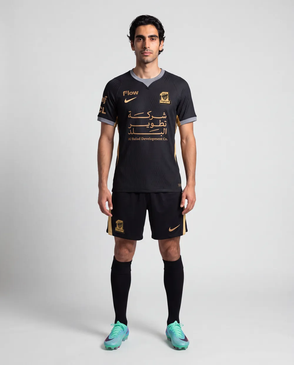 Away shirt on model, full length