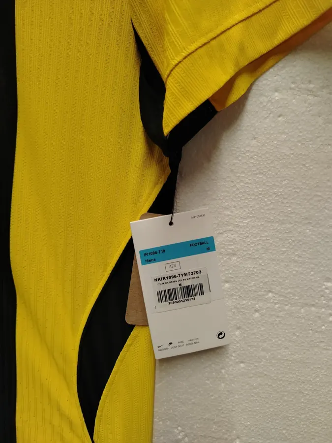 Phone photo of the real shirt on a hanger